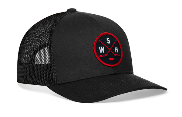 Black trucker cap with red-and-white logo patch and mesh side panels, curved brim.
