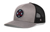 Gray-and-black hockey trucker hat with snapback and front logo patch, black mesh sides