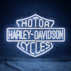 Harley-Davidson motorcycle neon sign with bright white-blue glow and connected cable