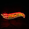 Hot Wheels neon sign light glowing in red and yellow, arched logo shape