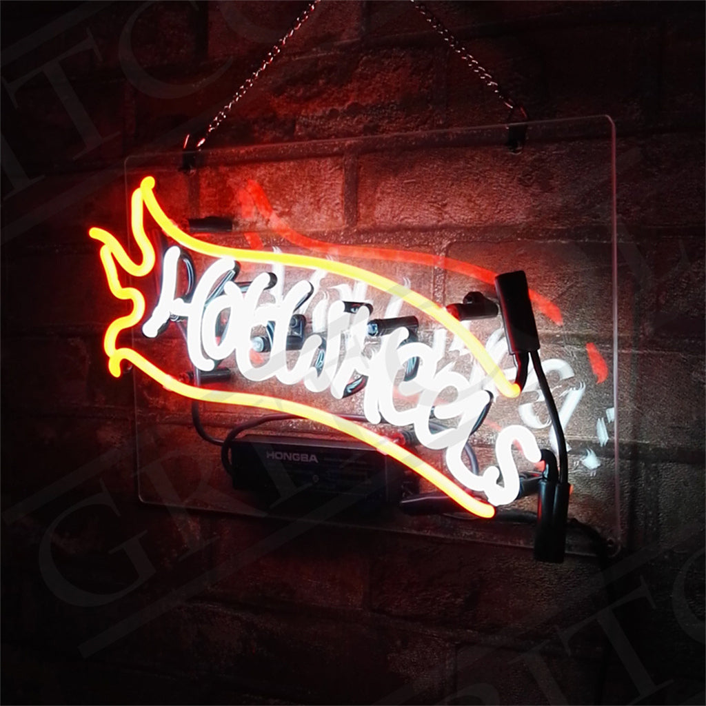 Hot Wheels neon sign with yellow/red glow and white cursive text on black frame