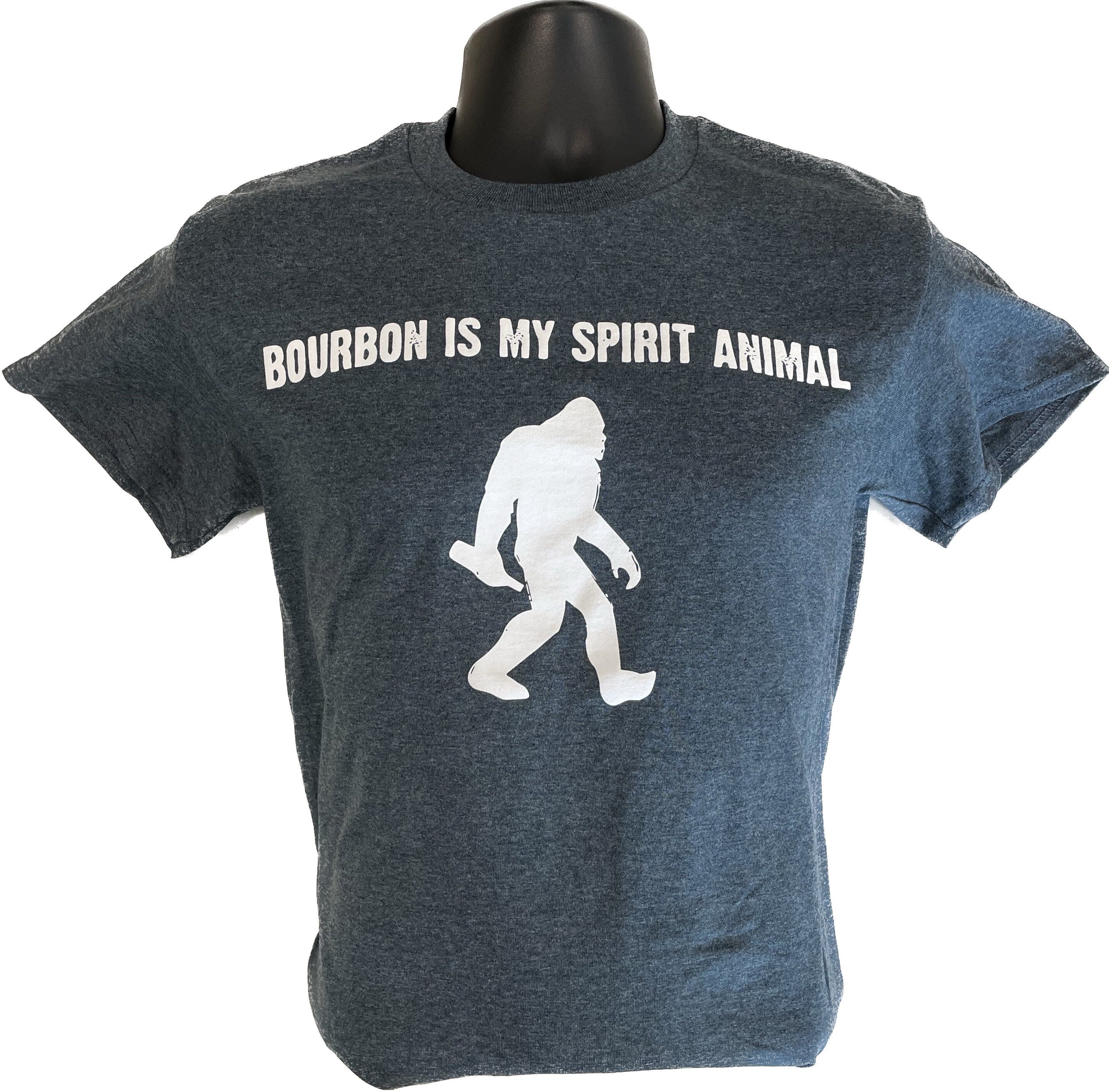 Unisex dark heather T-shirt with white Sasquatch graphic and slogan print