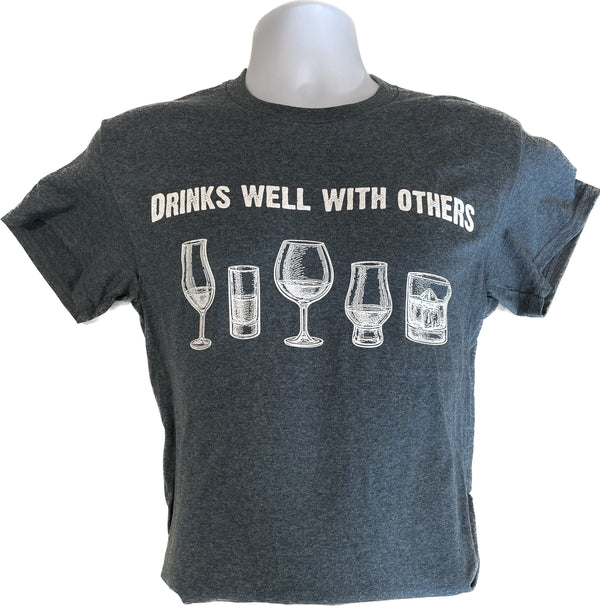 Unisex dark heather T-shirt with drink-glass graphic and 'DRINKS WELL WITH OTHERS'