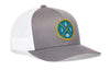 Gray trucker hat with circular team patch and white mesh side panels