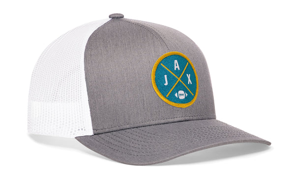 Gray trucker hat with circular team patch and white mesh side panels