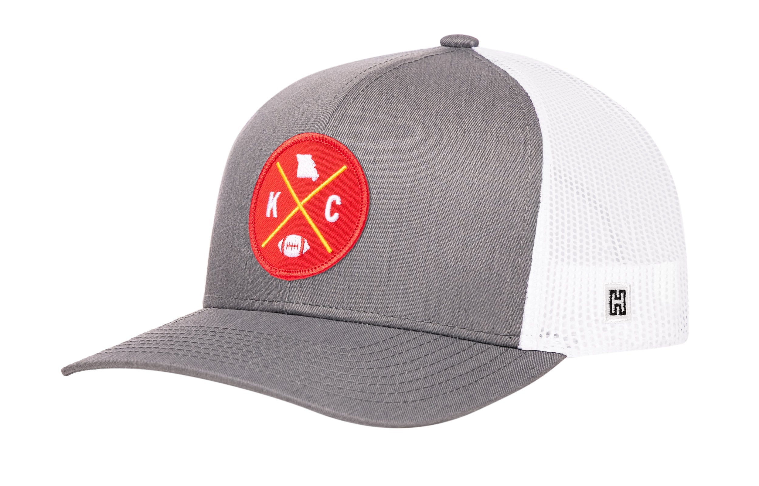 Gray trucker cap with red logo patch and white mesh side panels