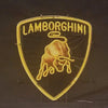 Lamborghini shield neon sign with LAMBORGHINI text and bull outline, warm yellow glow