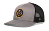 Heather gray and black trucker hat with circular LV hockey logo patch, mesh sides, brim.