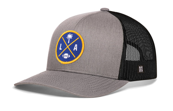Gray trucker cap with mesh side panels and round LA X logo patch