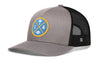 Gray front trucker cap with LA X logo patch, black mesh side panels, snapback