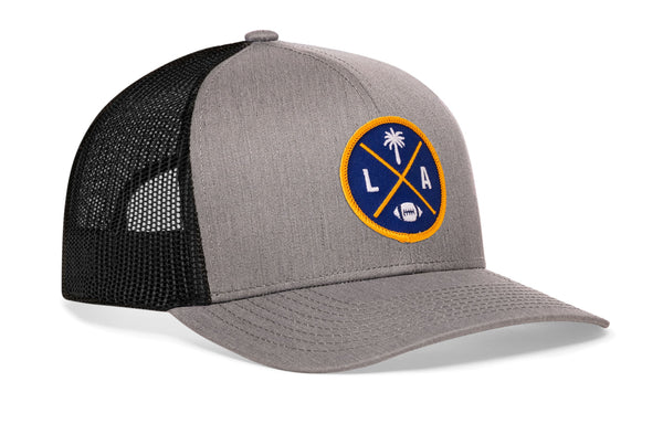 Gray trucker cap with black mesh side panels and round LA X logo patch