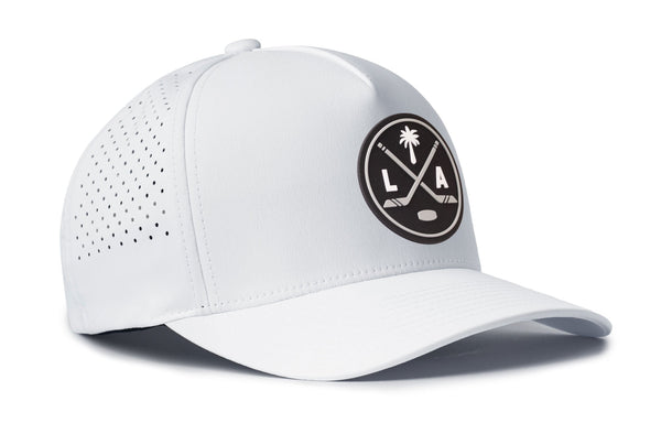 White 5-panel performance cap with LAX patch, curved brim, perforated side panels