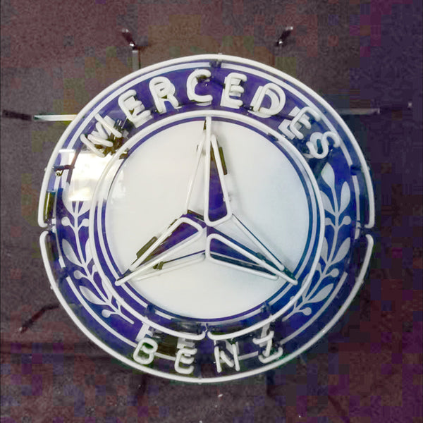 Circular neon logo sign with Mercedes three-point star and 'MERCEDES BENZ' text, white glow