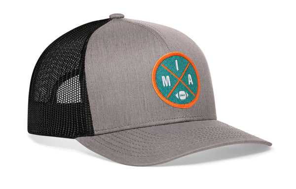 Gray trucker cap with black mesh back, curved brim, circular MIA patch on side