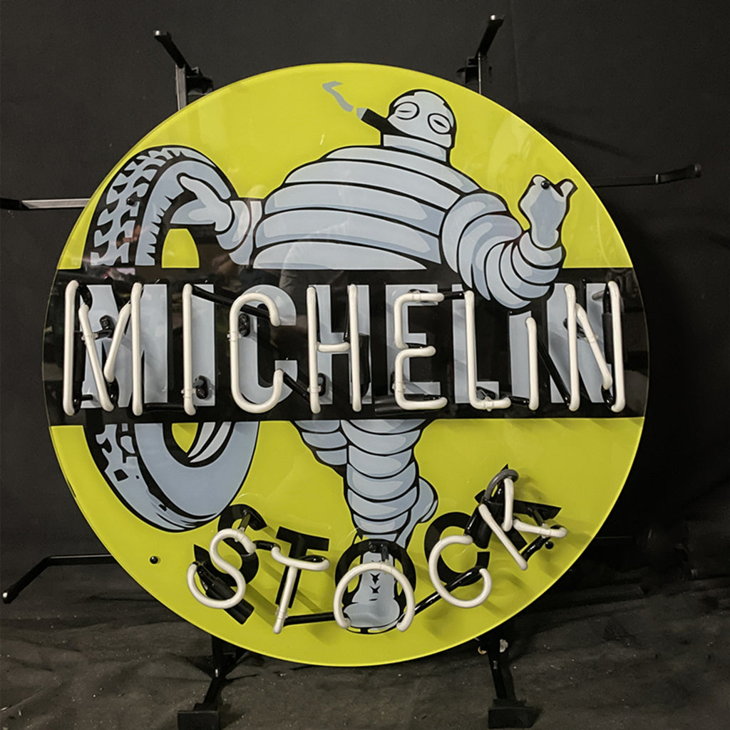 Michelin neon stock light sign, circular yellow with white MICHELIN letters and STOCK text