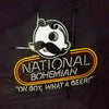 Neon light sign with white mascot outline and stacked “National Bohemian” text