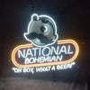 Neon light sign with mascot face and glowing “National Bohemian” lettering
