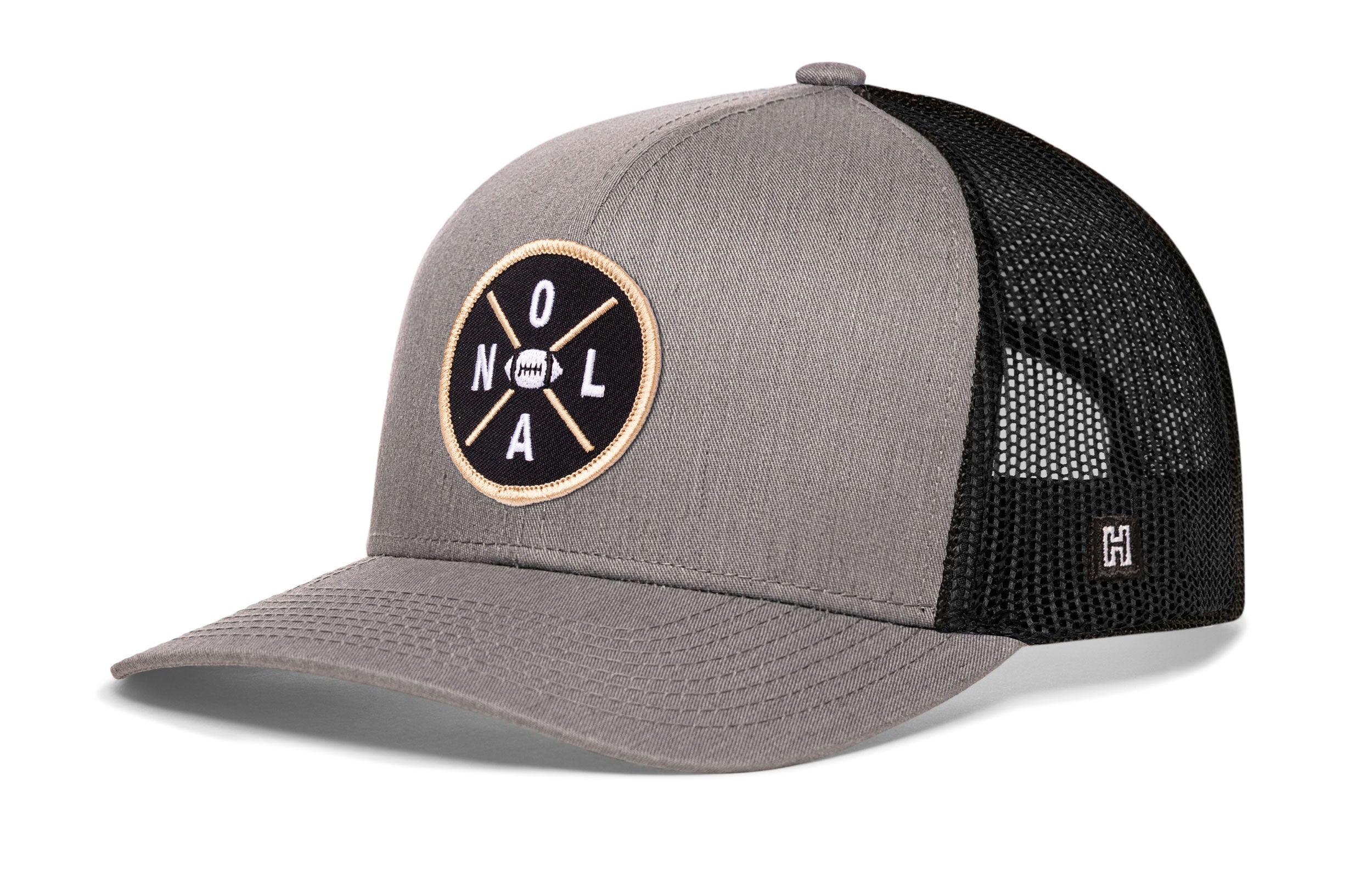 Gray-and-black trucker snapback hat with front NOLA logo patch and mesh back.
