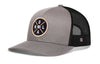 Gray-and-black trucker snapback hat with front NOLA logo patch and mesh back.