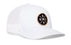 White trucker snapback hat with round NOLA logo patch on the front panel.