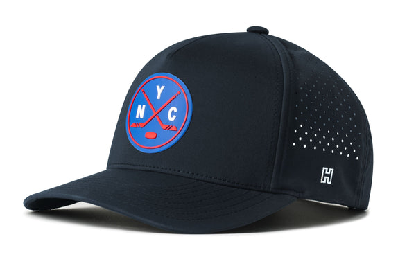 Navy 5-panel snapback hat with YC badge and perforated side panels