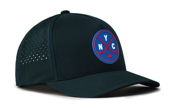 Dark 5-panel snapback hat with YC badge and perforated side panel