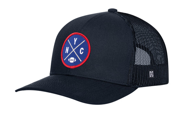 Navy trucker snapback hat with round logo patch and mesh side panels
