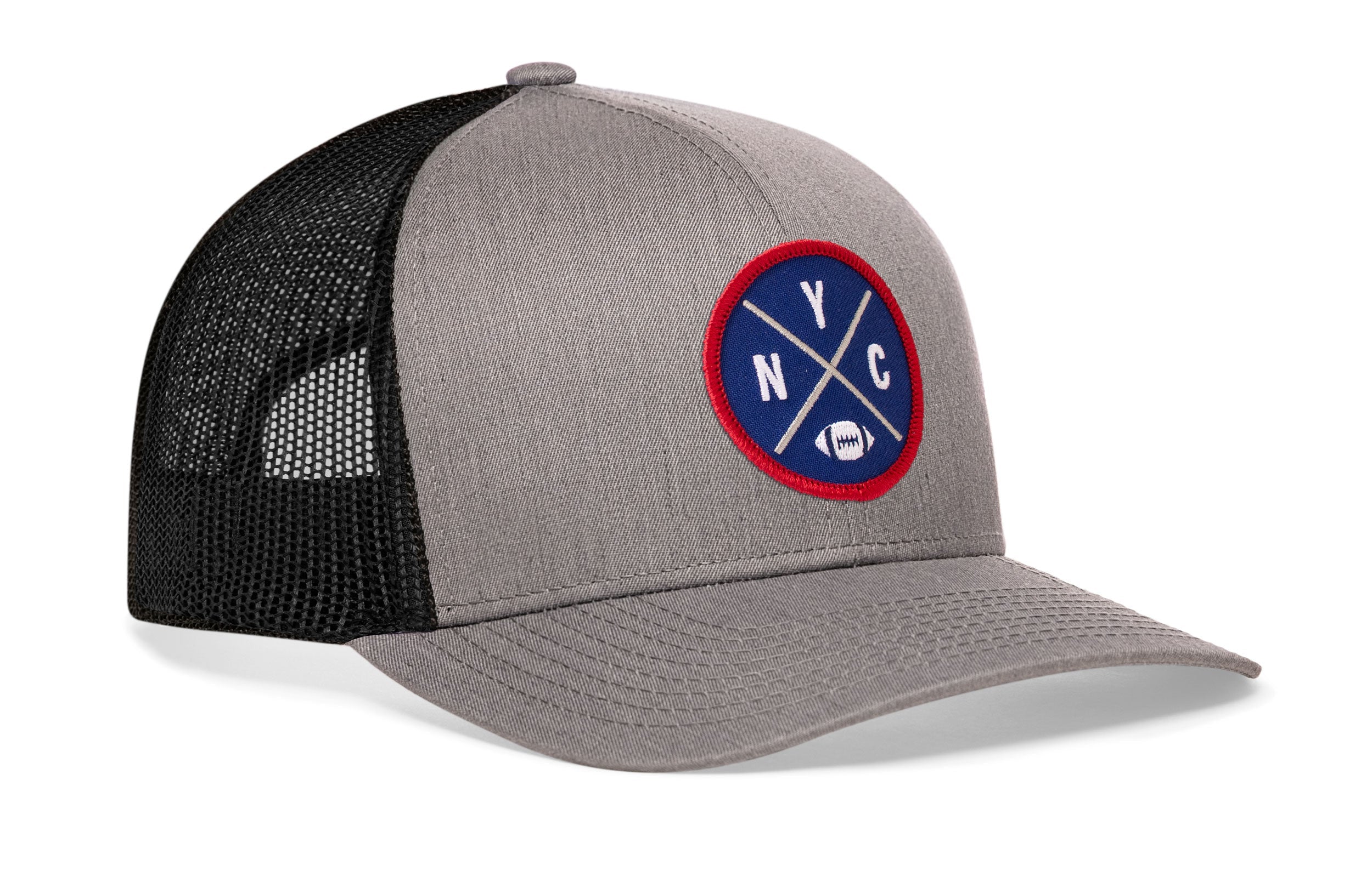 Gray trucker snapback hat, side view with round logo patch and black mesh