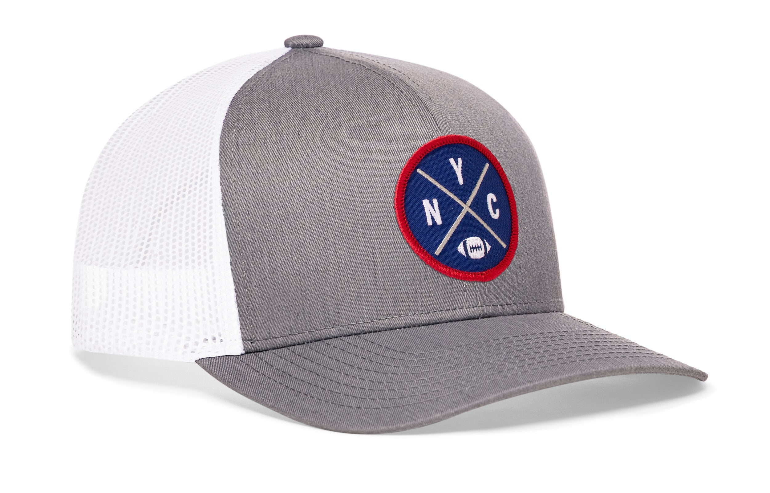 Light gray trucker snapback hat, side view with round logo patch and white mesh