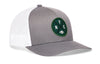 Gray-and-white trucker snapback hat with green NYC patch and front logo, mesh back panels