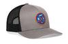 Gray trucker snapback cap with round NY hockey patch and black mesh side panels