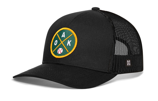 Oakland baseball trucker hat in black with front round logo patch and mesh back