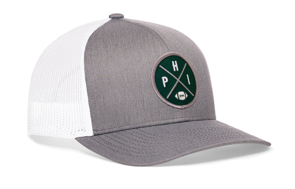 Gray front trucker hat with green round logo patch and white mesh back, snapback