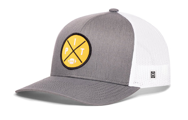 Gray front trucker snapback hat with yellow logo patch and white mesh side panels