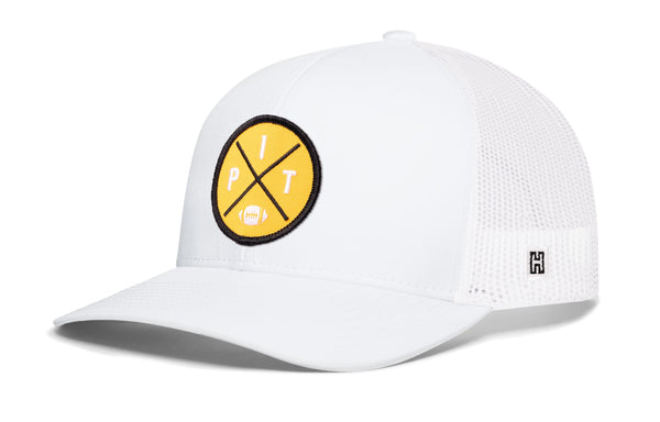 White trucker snapback hat with yellow logo patch and mesh side panels