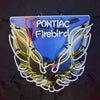 Neon Pontiac Firebird wall sign, blue plate, winged flame outline, red and yellow neon glow