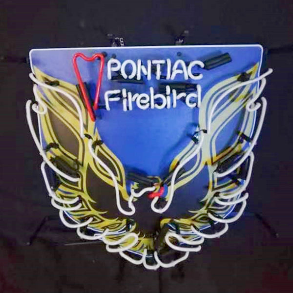 Neon Pontiac Firebird wall sign, blue plate, winged flame outline, red and yellow neon glow