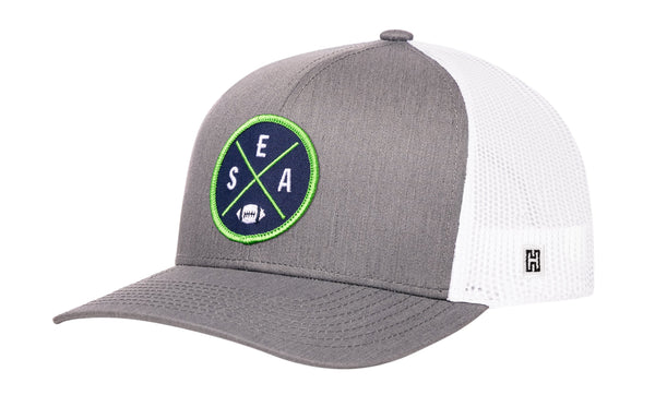 Gray trucker baseball cap with green SEA X A logo patch and white mesh side panels