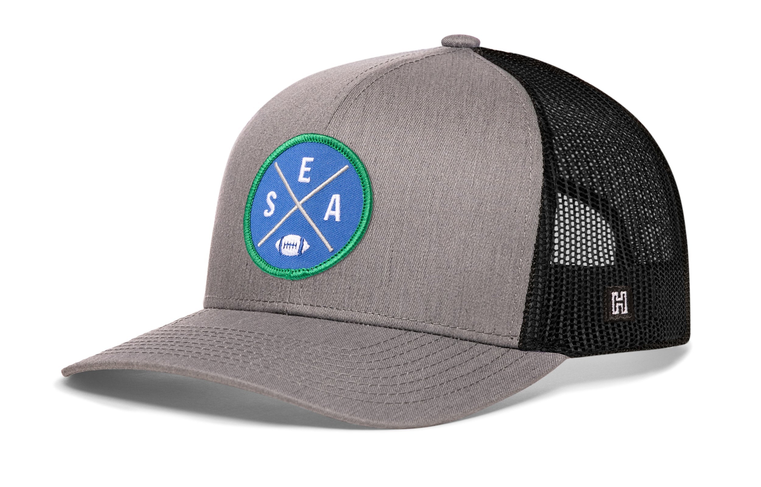 Gray front trucker hat with round SEA X patch and black mesh side panels