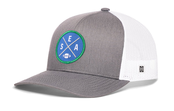 Gray front trucker hat with round SEA X patch and white mesh side panels