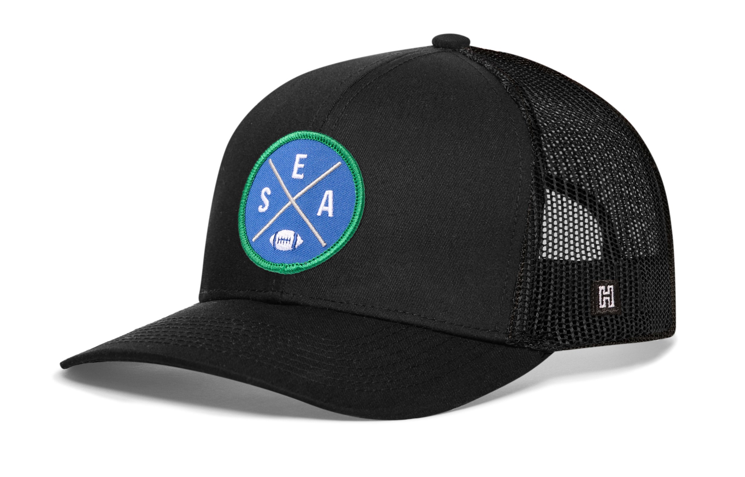 Black trucker hat with round SEA X patch and black mesh side panels