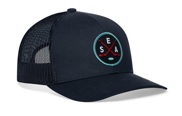 Navy trucker hat with black mesh sides, curved brim, and SEA X logo patch