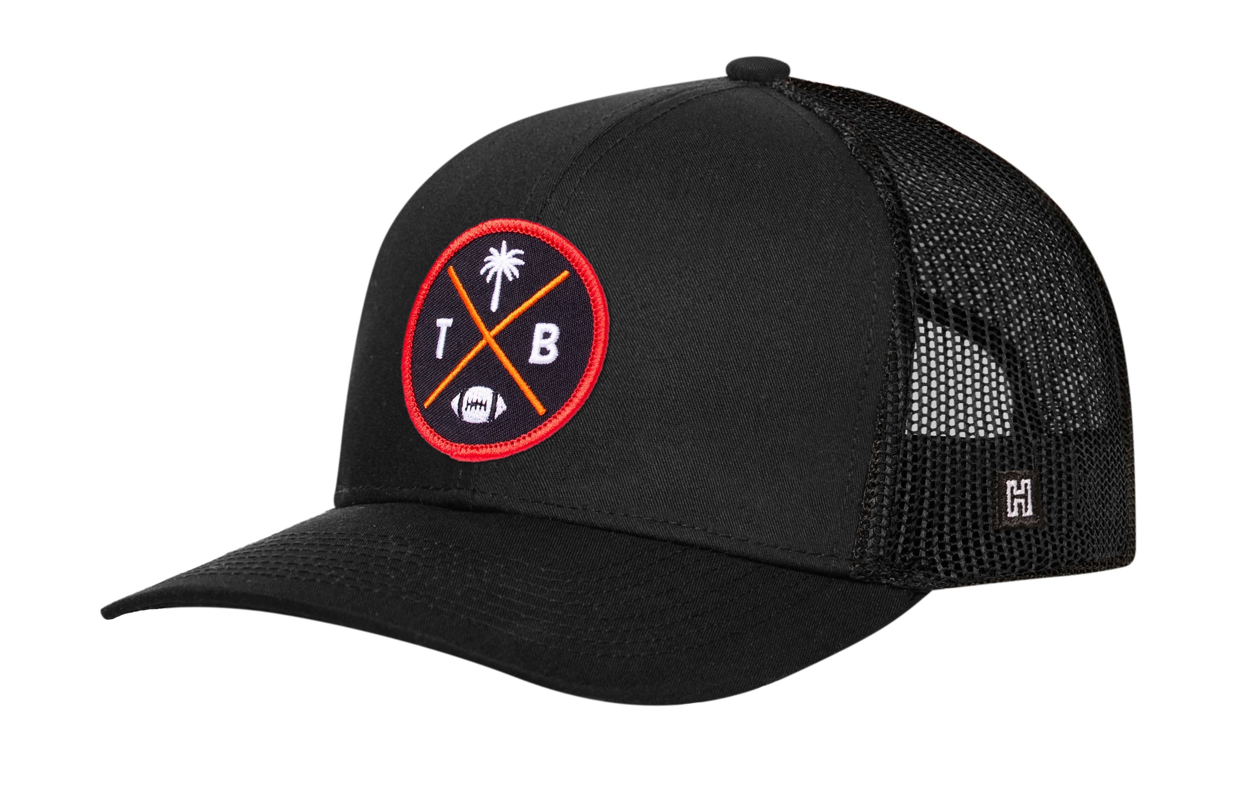 Black trucker hat with red logo patch, curved brim, and mesh back panels