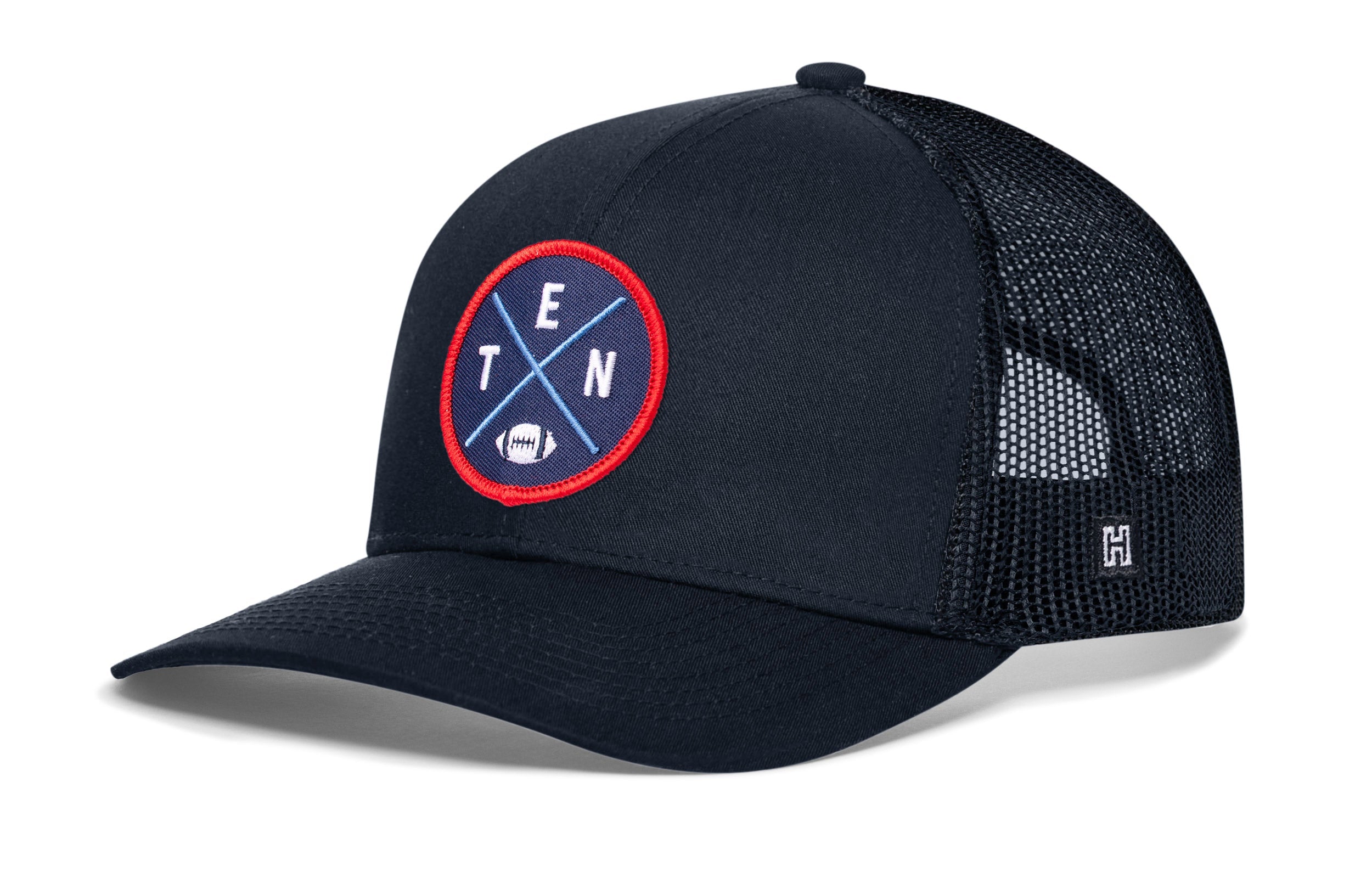 Navy trucker cap with black mesh sides, round logo patch, and small H emblem