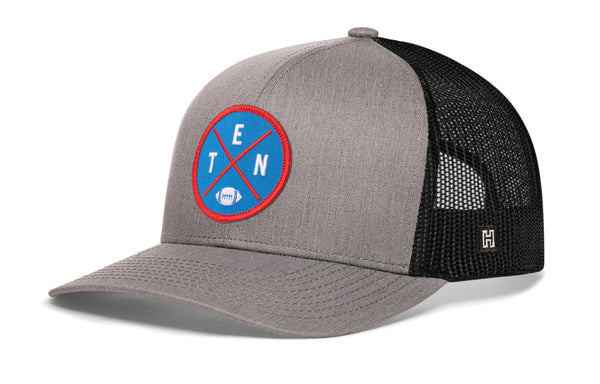 Gray and black trucker cap with mesh sides and round TEN logo patch on front
