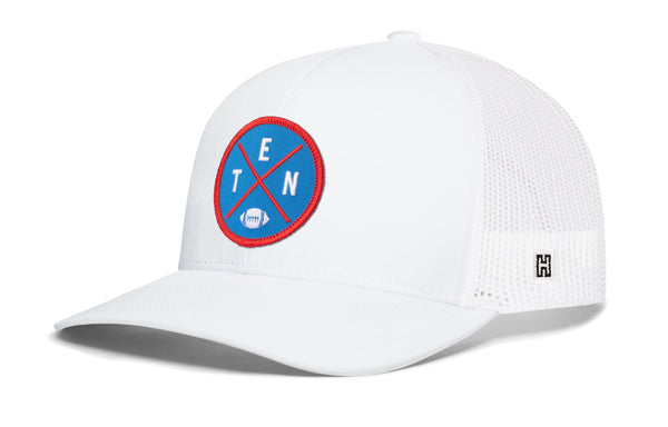 White trucker cap with mesh sides and round TEN logo patch on front