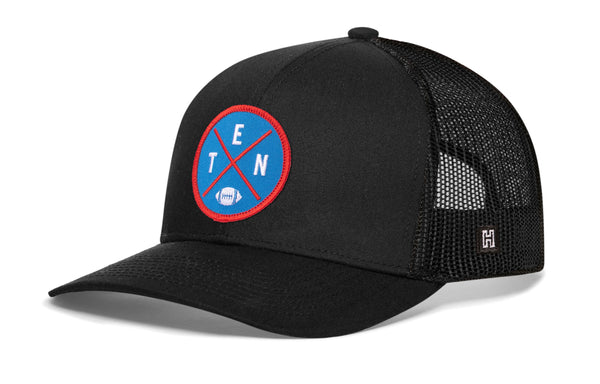 Black trucker cap with mesh sides and round TEN logo patch on front