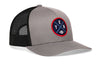 Gray trucker cap with black mesh side panels, round logo patch, and small H emblem