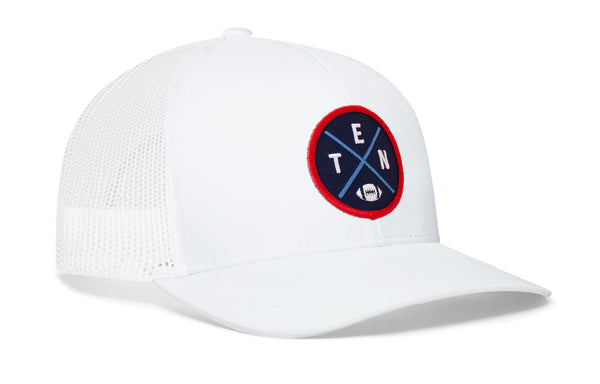 White trucker cap with mesh side panels, round logo patch, and small H emblem