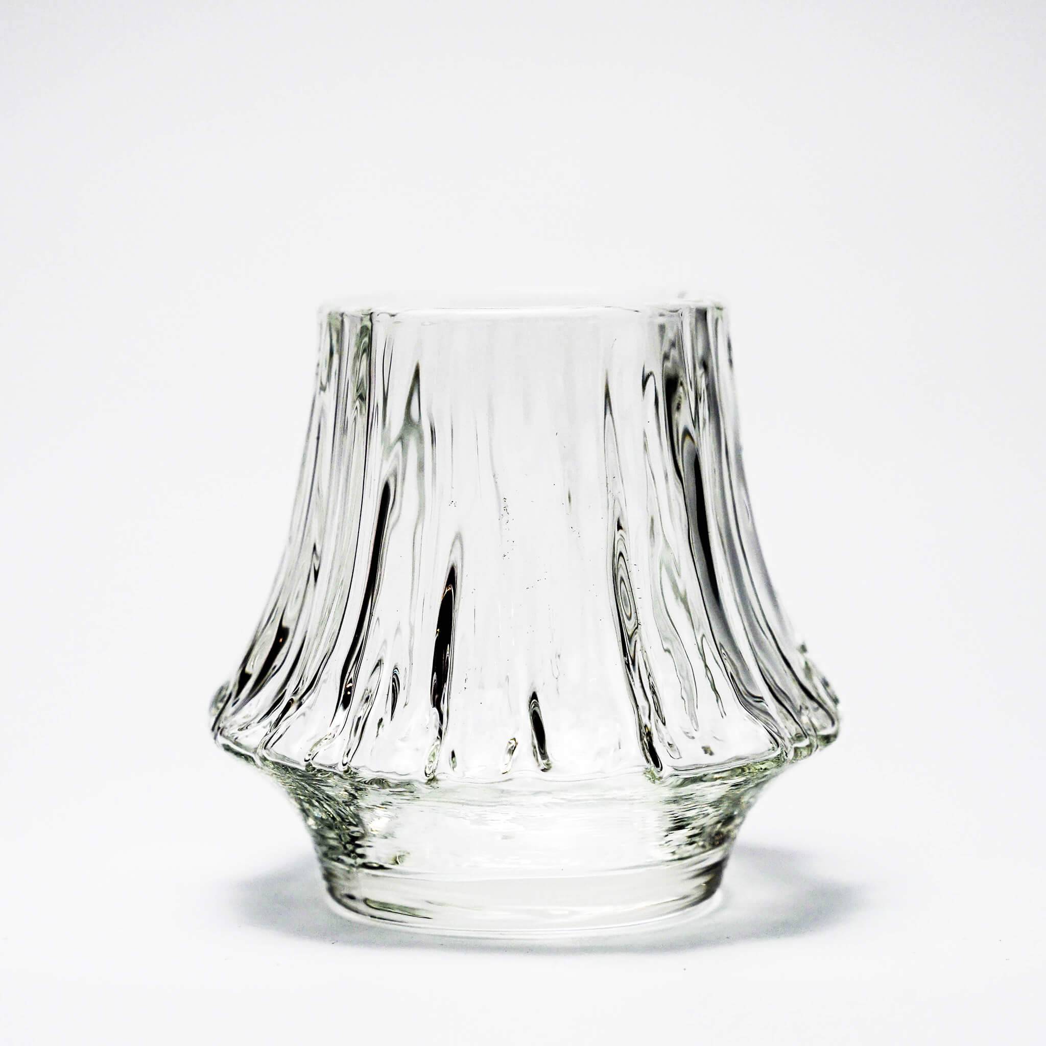 Clear crystal whisky tumbler with fluted design and rounded base